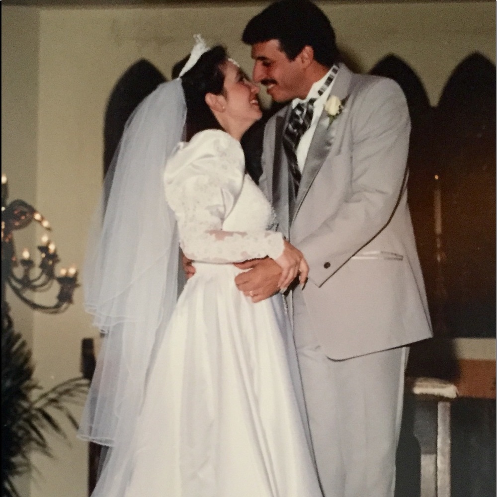 White wedding dress and 3- tierveil